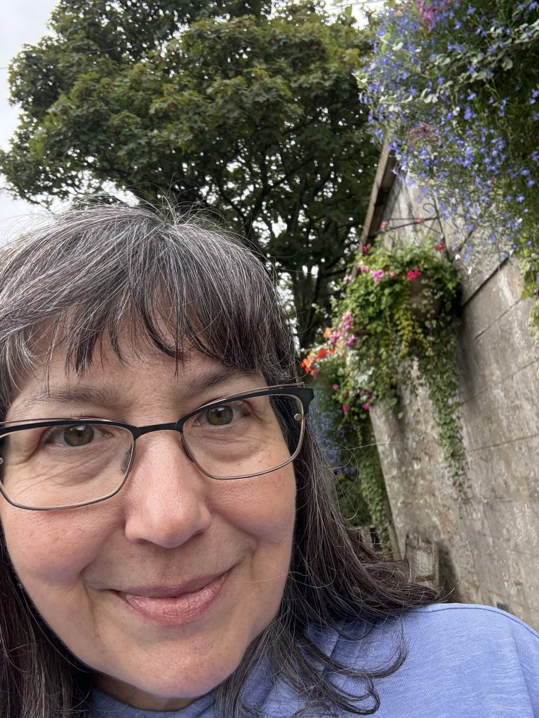 With Dean Jenny Holden, at Cruden Bay, standing next to Sloan Castle